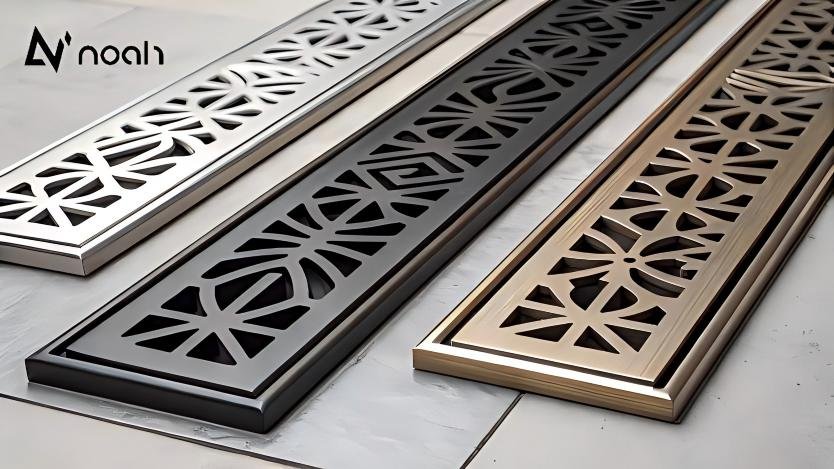 "Close-up of linear drain with decorative grate options in various finishes"